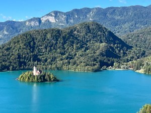 View of the Pilgrimage Church of the Assumption of Mary on Lake Bled from Bled Castle high above the lake.
